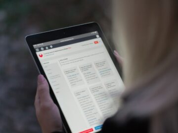 person holding black tablet computer