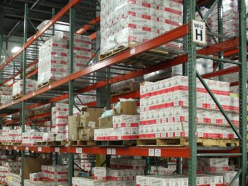 white and red cardboard boxes on shelf