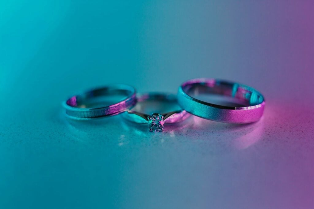 a couple of wedding rings sitting on top of a table