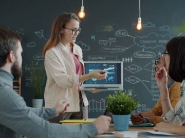 Woman presenting a business strategy to colleagues